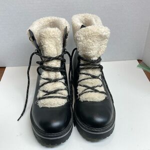 Tommy Hilfiger size 10M women’s black and white boots.